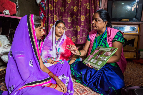 Rajani counsels a client and her mother-in-law