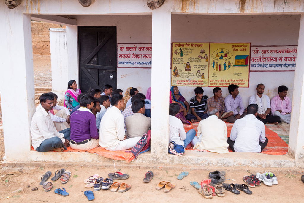 A group of men sitting together at a health center